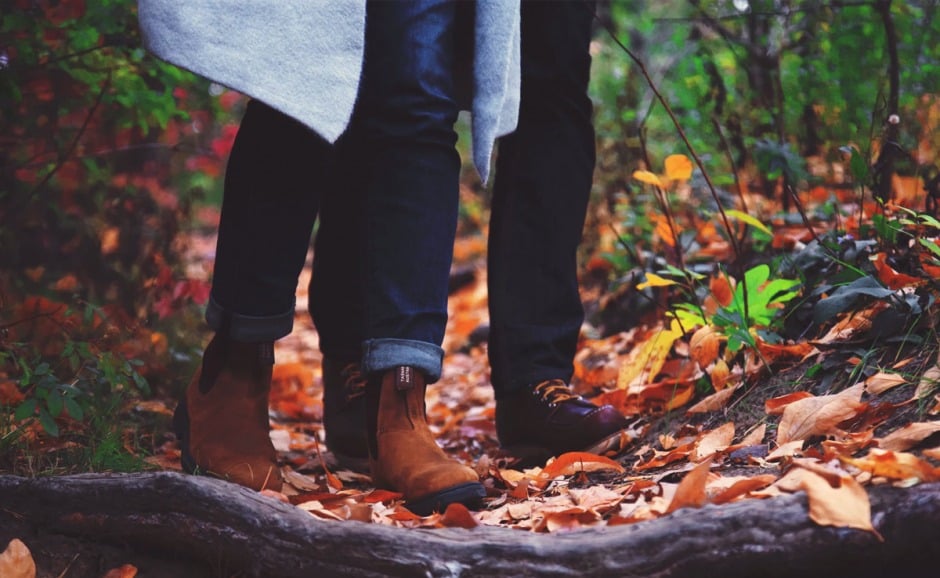 Couple walking in Autumnal woods