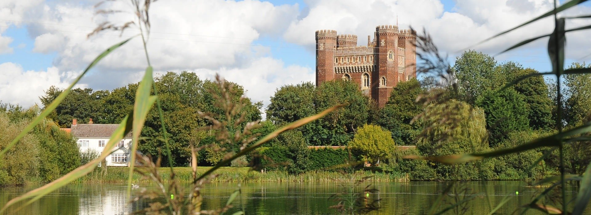 Tattershall Castle set behind lake Tattershall Castle set behind lake