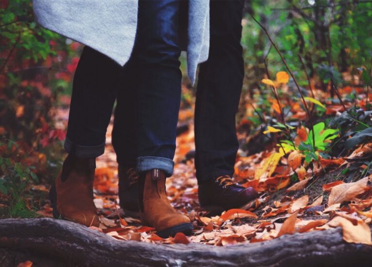 Couple walking in Autumnal woods